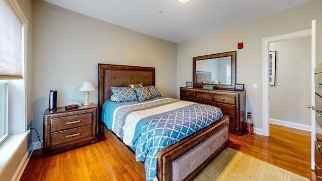 1100 Vfw Pkwy Unit 202, Boston, MA 02132 - bedroom with wood finished floors and baseboards