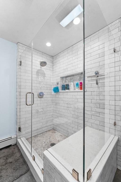 full bathroom with a shower stall, recessed lighting, and a baseboard heating unit