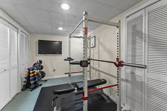 workout room with recessed lighting, baseboards, and an ornate ceiling