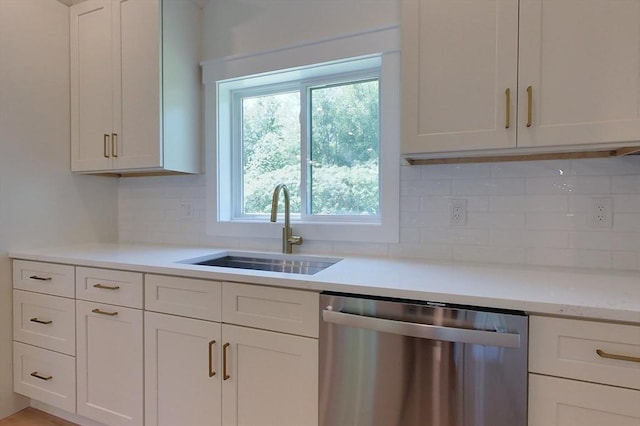 12 Willow St, Pepperell, MA 01463 - kitchen with dishwasher, a sink, decorative backsplash, and white cabinets