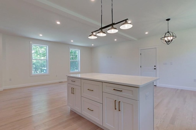 12 Willow St, Pepperell, MA 01463 - kitchen featuring light wood finished floors, decorative light fixtures, open floor plan, recessed lighting, and beam ceiling