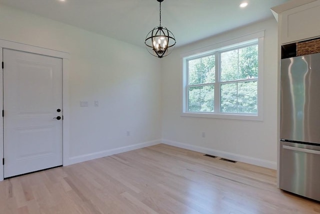 12 Willow St, Pepperell, MA 01463 - unfurnished dining area featuring light wood-style flooring, a chandelier, baseboards, and recessed lighting