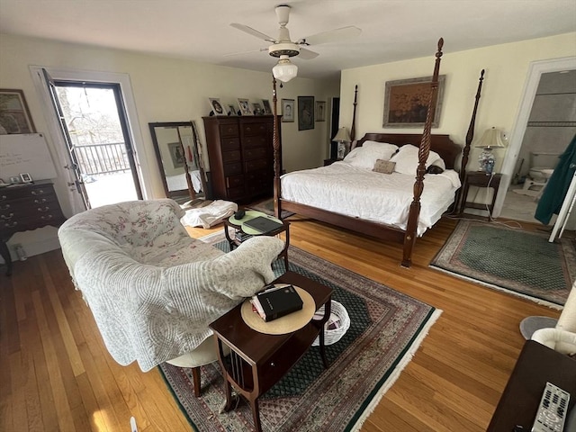 bedroom with wood finished floors, access to exterior, and ceiling fan