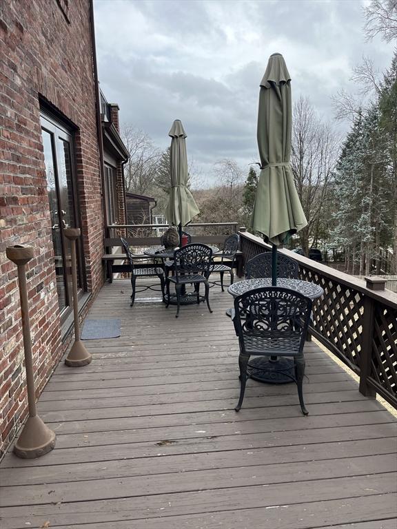 wooden deck with outdoor dining area