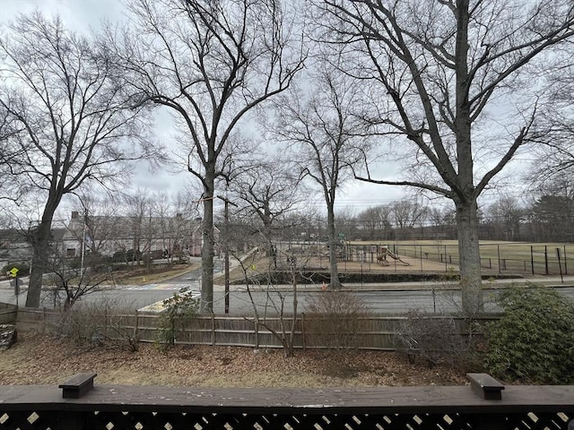 view of yard featuring a playground and fence