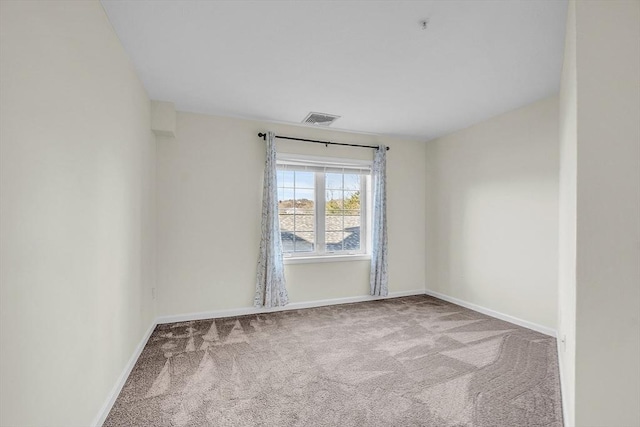 unfurnished room with carpet floors