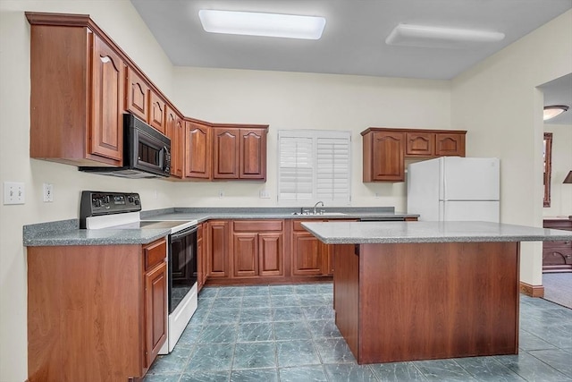 kitchen featuring a center island, white appliances, and sink