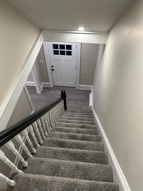 staircase featuring recessed lighting and baseboards