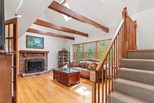 525 Thurston St, Wrentham, MA 02093 - living area featuring light wood-style flooring, stairs, and a brick fireplace
