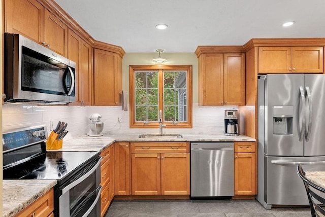 525 Thurston St, Wrentham, MA 02093 - kitchen with stainless steel appliances, a sink, tasteful backsplash, light stone counters, and recessed lighting