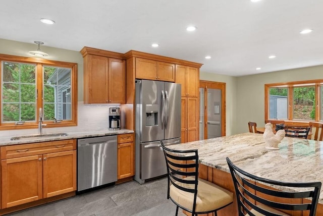 525 Thurston St, Wrentham, MA 02093 - kitchen featuring stainless steel appliances, a sink, plenty of natural light, recessed lighting, and light stone countertops