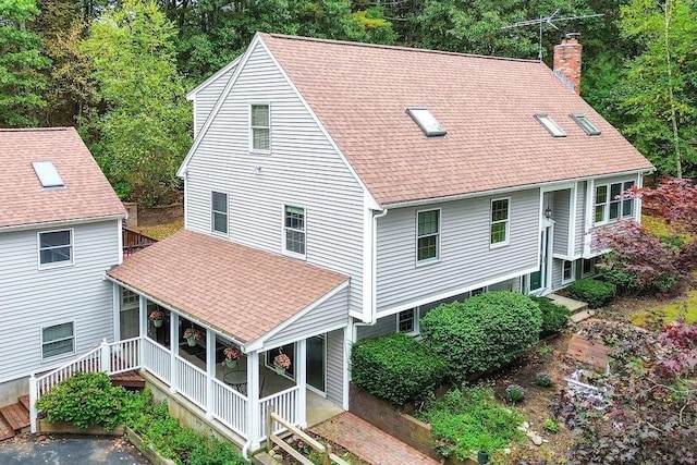 525 Thurston St, Wrentham, MA 02093 - rear view of house featuring a chimney, a shingled roof, and a porch