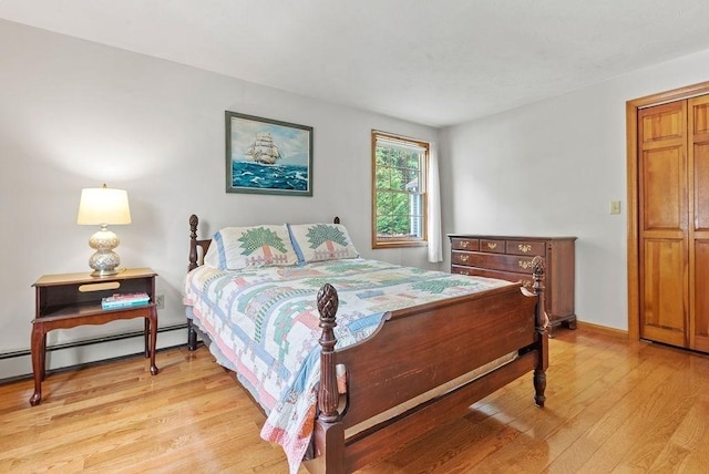 525 Thurston St, Wrentham, MA 02093 - bedroom with baseboard heating, light wood-style floors, and baseboards