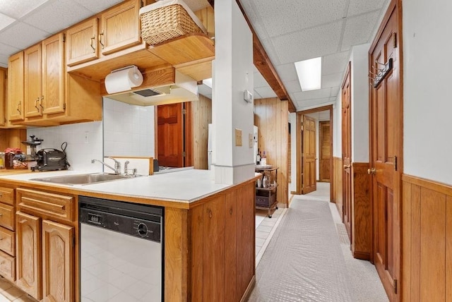 525 Thurston St, Wrentham, MA 02093 - kitchen with dishwasher, a drop ceiling, a sink, wooden walls, and light countertops