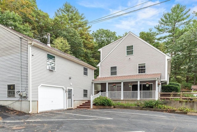 525 Thurston St, Wrentham, MA 02093 - back of property with an attached garage and covered porch