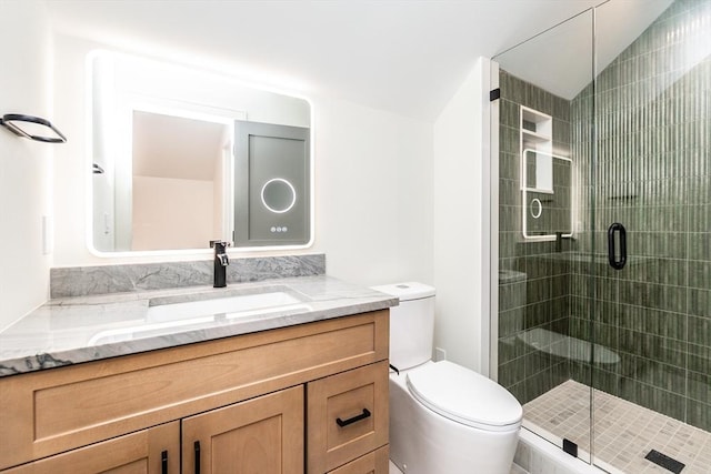 full bath featuring toilet, a stall shower, lofted ceiling, and vanity