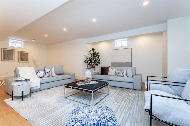 living room with baseboards, wood finished floors, and recessed lighting