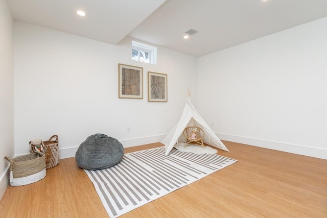 game room featuring baseboards, visible vents, wood finished floors, and recessed lighting