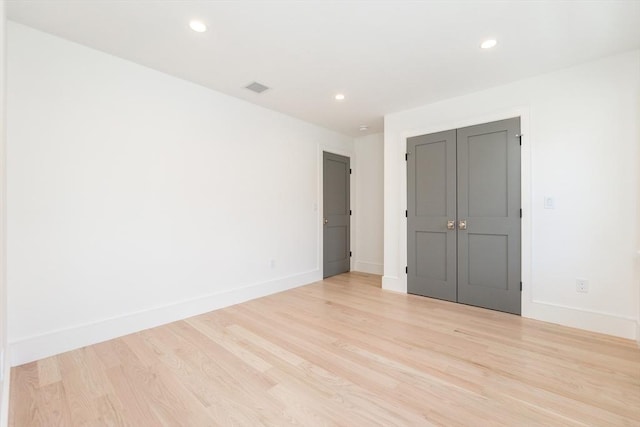 unfurnished bedroom with recessed lighting, baseboards, visible vents, and light wood finished floors