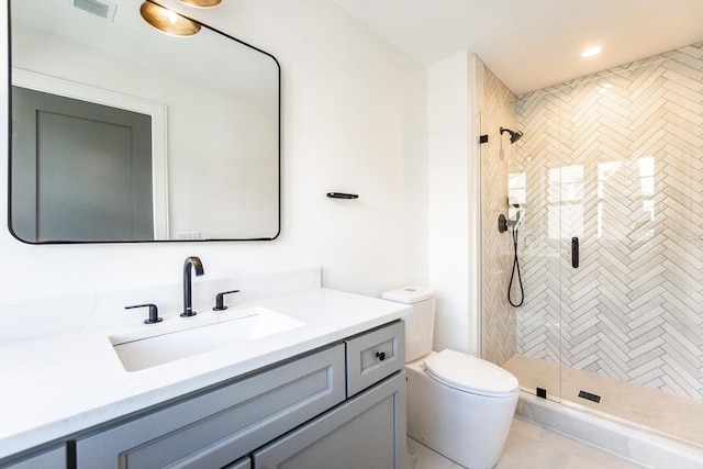 full bath featuring vanity, a shower stall, and toilet