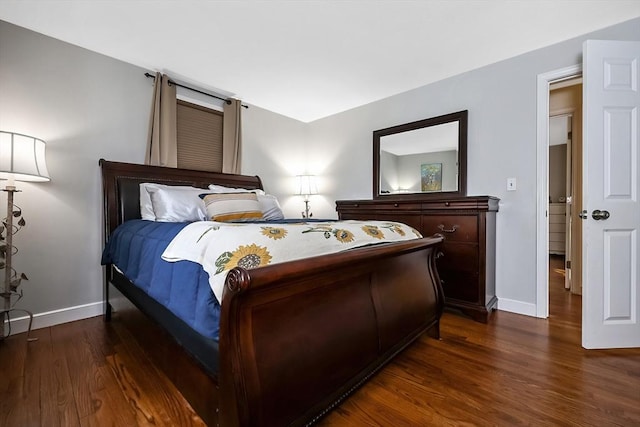 bedroom with dark wood-style floors and baseboards