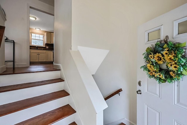 stairs featuring baseboards