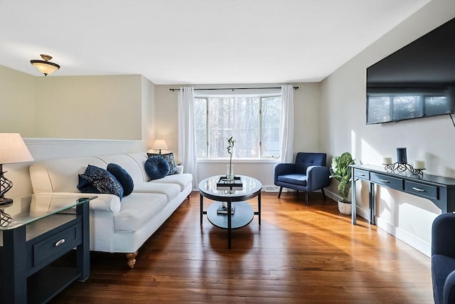 living area featuring dark wood finished floors and baseboards