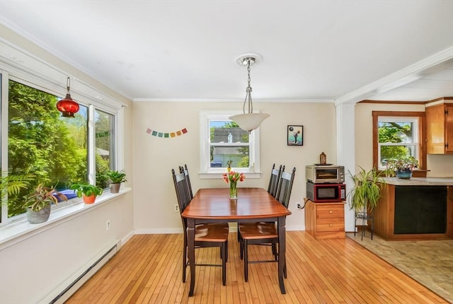 130 N Walker St, Taunton, MA 02780 - dining space featuring baseboard heating, light wood-style flooring, healthy amount of natural light, and ornamental molding