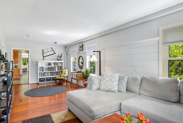 130 N Walker St, Taunton, MA 02780 - living room featuring plenty of natural light, wood finished floors, and wood walls