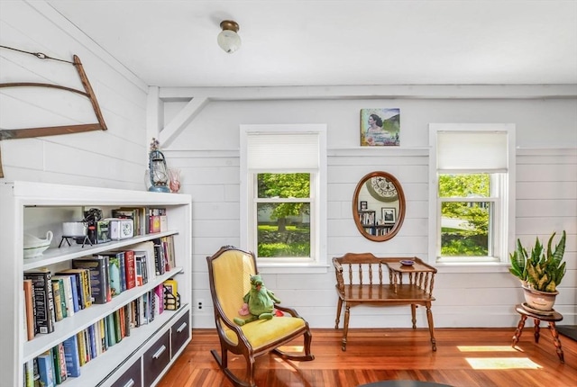 130 N Walker St, Taunton, MA 02780 - living area with plenty of natural light, wooden walls, and wood finished floors