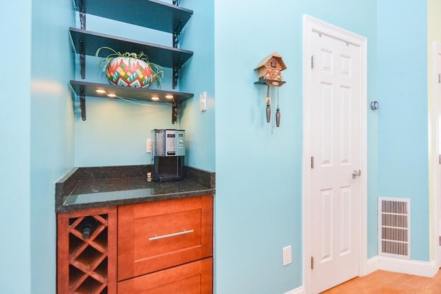 41 Oak St Unit 2, Waltham, MA 02453 - bar area featuring light wood finished floors and baseboards