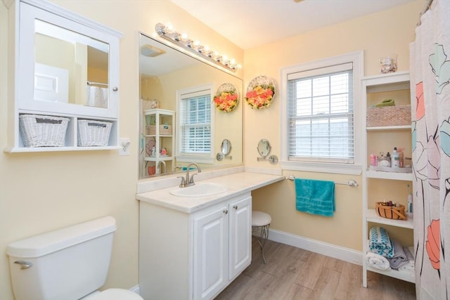 41 Oak St Unit 2, Waltham, MA 02453 - full bathroom with vanity and wood finished floors