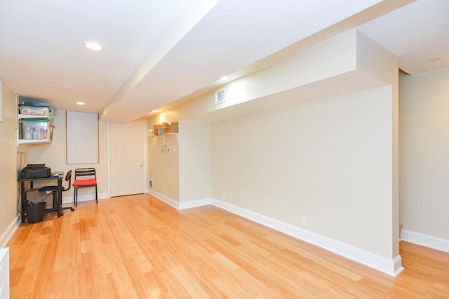 41 Oak St Unit 2, Waltham, MA 02453 - finished below grade area with light wood-style floors and recessed lighting