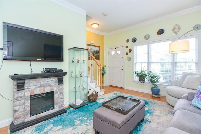 41 Oak St Unit 2, Waltham, MA 02453 - living room with stairs, ornamental molding, a stone fireplace, and wood finished floors
