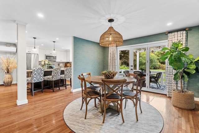 dining area with recessed lighting, baseboards, french doors, and light wood-style flooring