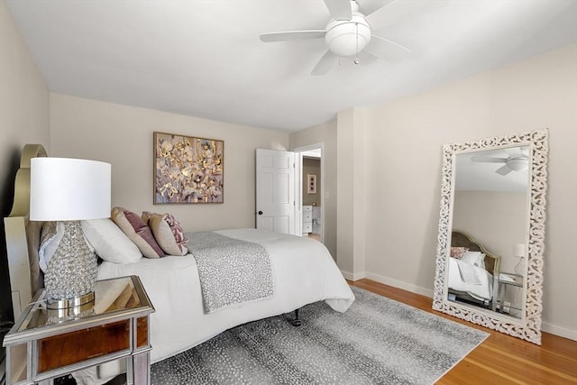 bedroom featuring baseboards, ceiling fan, and wood finished floors