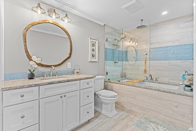 full bathroom with a combined bath / shower with rainfall shower, visible vents, toilet, and vanity