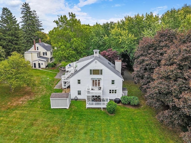 birds eye view of property featuring a forest view