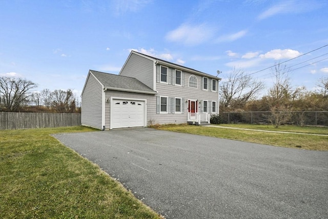 view of front facade featuring a garage and a front lawn