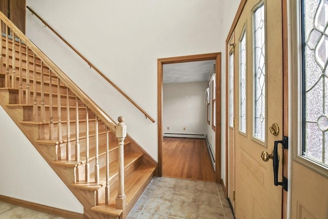 entryway with a baseboard radiator and light hardwood / wood-style flooring