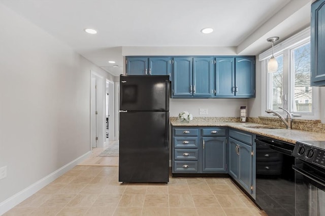 kitchen with a sink, blue cabinets, baseboards, and black appliances