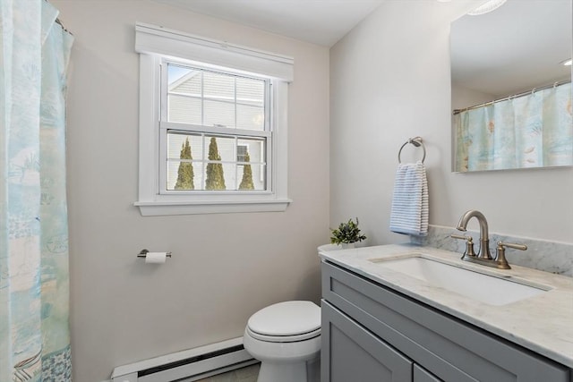 bathroom with a baseboard radiator, toilet, and vanity