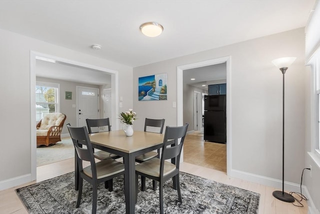 dining space with baseboards