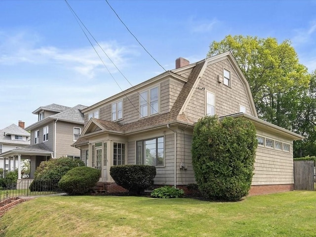 view of home's exterior featuring a gambrel roof, a chimney, and a shingled roof