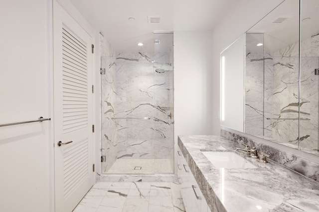 bathroom with vanity and a shower with shower door