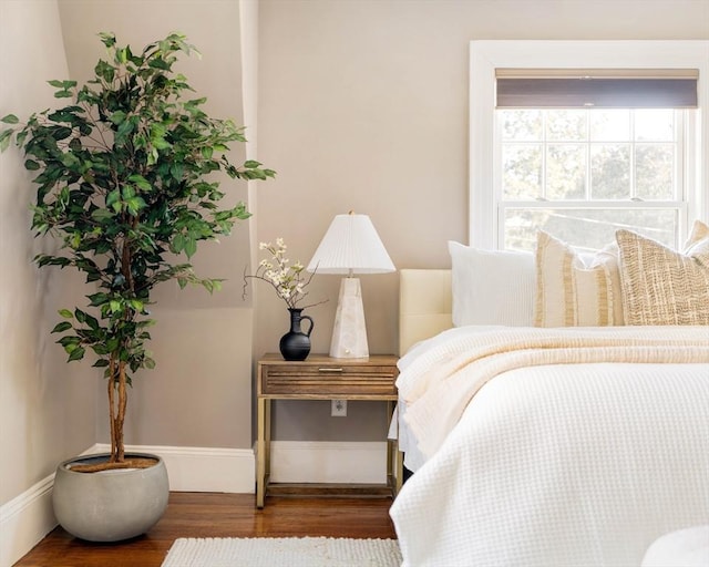 bedroom featuring dark hardwood / wood-style flooring