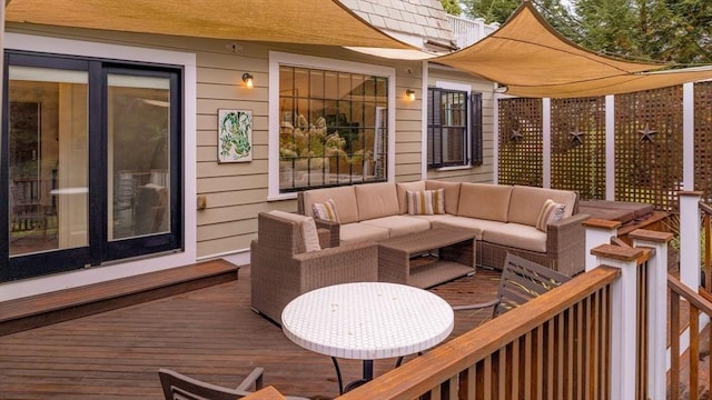 wooden deck featuring an outdoor hangout area