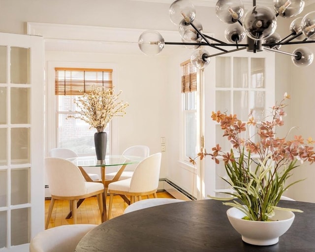 dining area with a baseboard heating unit