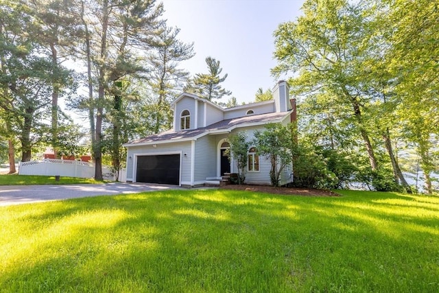 166 Massapoag Rd, Tyngsborough, MA 01879 - view of front of home featuring driveway, an attached garage, and a chimney