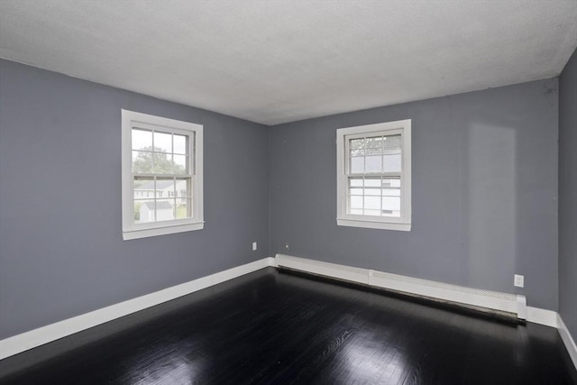 7 Summit Dr, Westfield, MA 01085 - spare room featuring healthy amount of natural light, baseboard heating, and dark wood-style floors